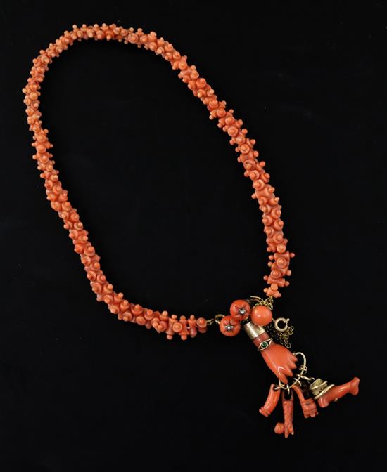 A late 19th/early 20th century gold mounted carved coral necklace with clasp set with coral and seed pearl beads